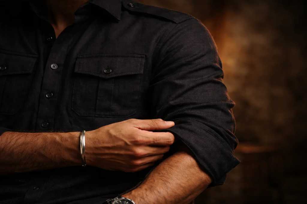 Close up of high quality black cotton pathani suit fabric texture.